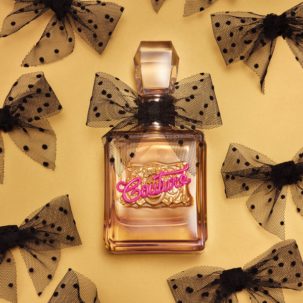 Displays the 'Juicy' branded Viva La Juicy Gold couture EDP 100ml bottle featuring the ribbons 