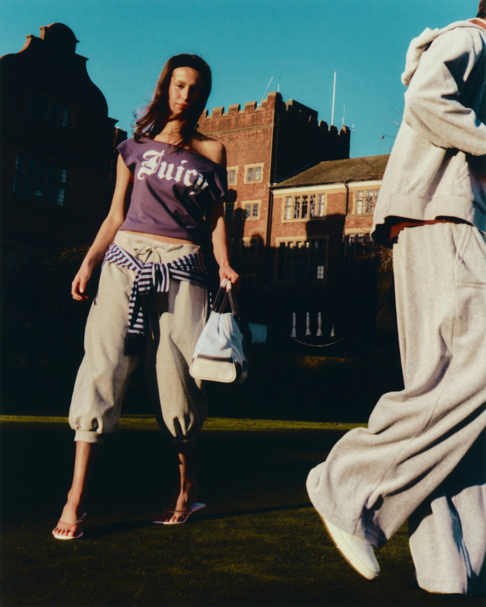 Displays a model wearing the Mood Indigo 'Juicy' branded off the shoulder T-shirt 