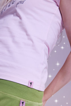 Displays a model wearing the Disney Cherry Blossom 'Juicy' branded believes in juicy tee 