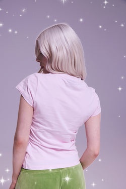 Displays a model wearing the Disney Cherry Blossom 'Juicy' branded believes in juicy tee 