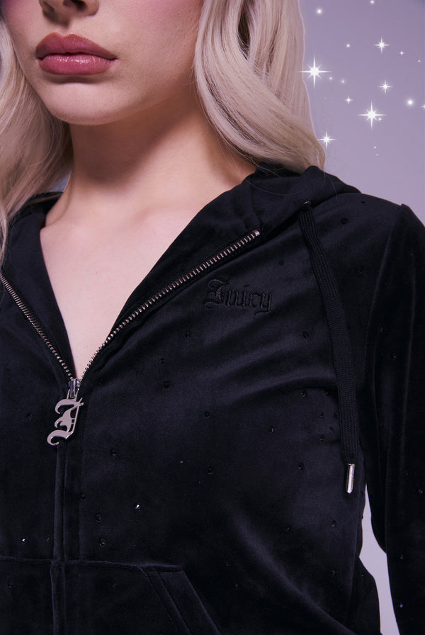 Displays a model wearing the Disney black 'juicy' branded Diamanté hoodie 