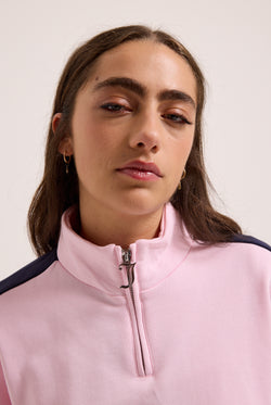 Displays a model wearing the Cherry Blossom 'Juicy' branded college crest track top  