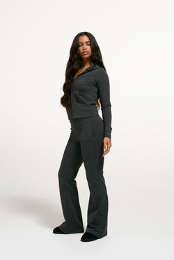 Displays a model wearing the Raven 'Juicy' branded Active Fitted Hoodie