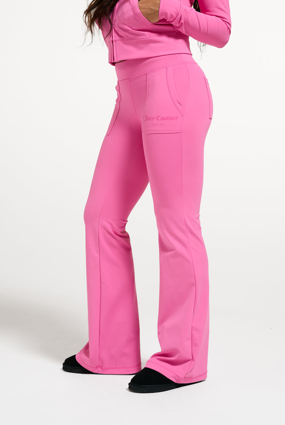 Displays a model wearing the Wild Orchid 'Juicy' branded active Low Rise Pant