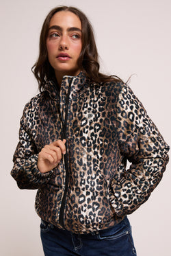 Displays a model wearing the leopard print velour 'Juicy' branded puffa jacket