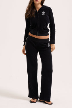 Displays a model wearing the black appliqué 'Juicy' branded Terry shrunken hoodie 