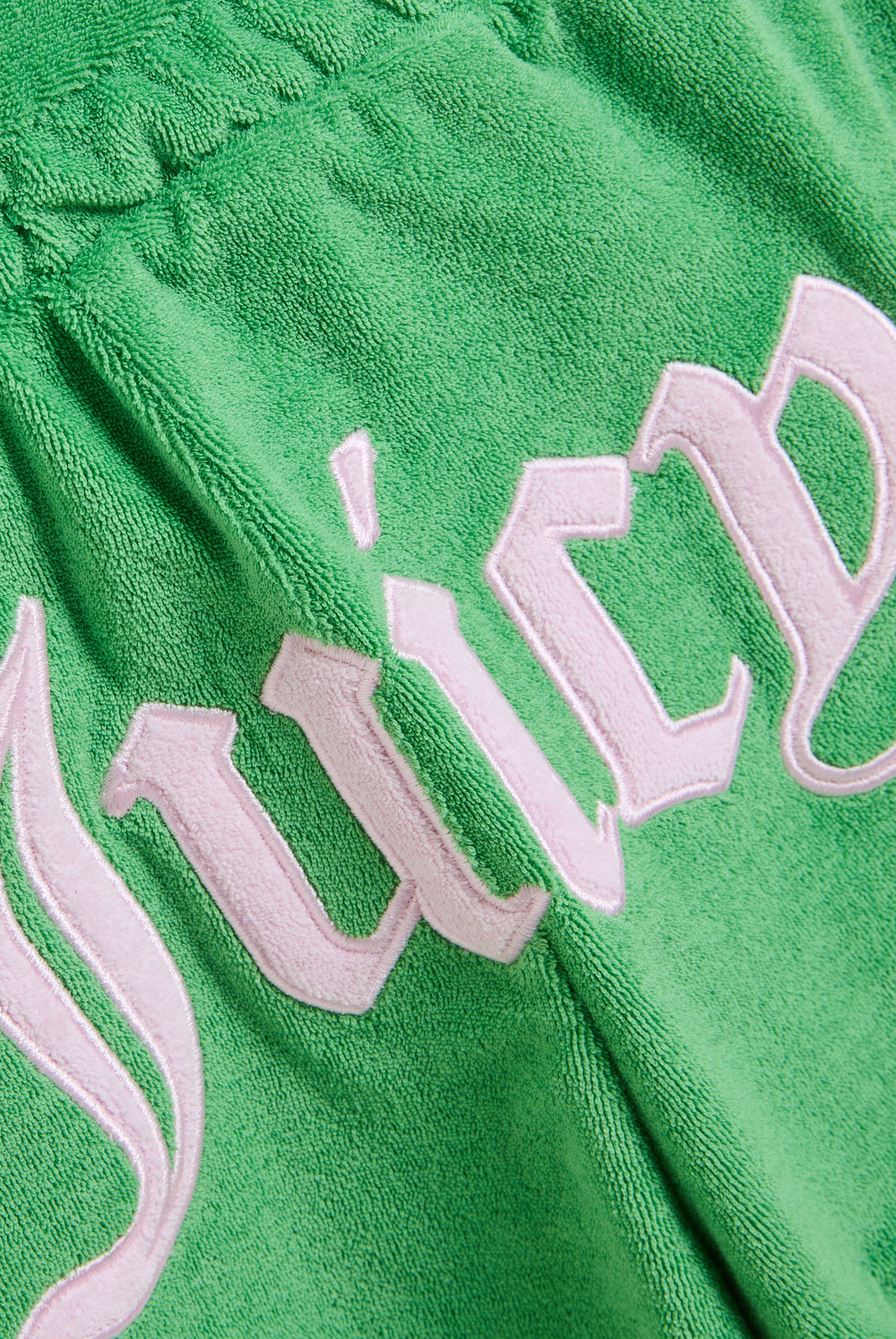 Displays the Peppermint Appliqué 'Juicy' branded Terry towelling romper featuring the juicy branding 