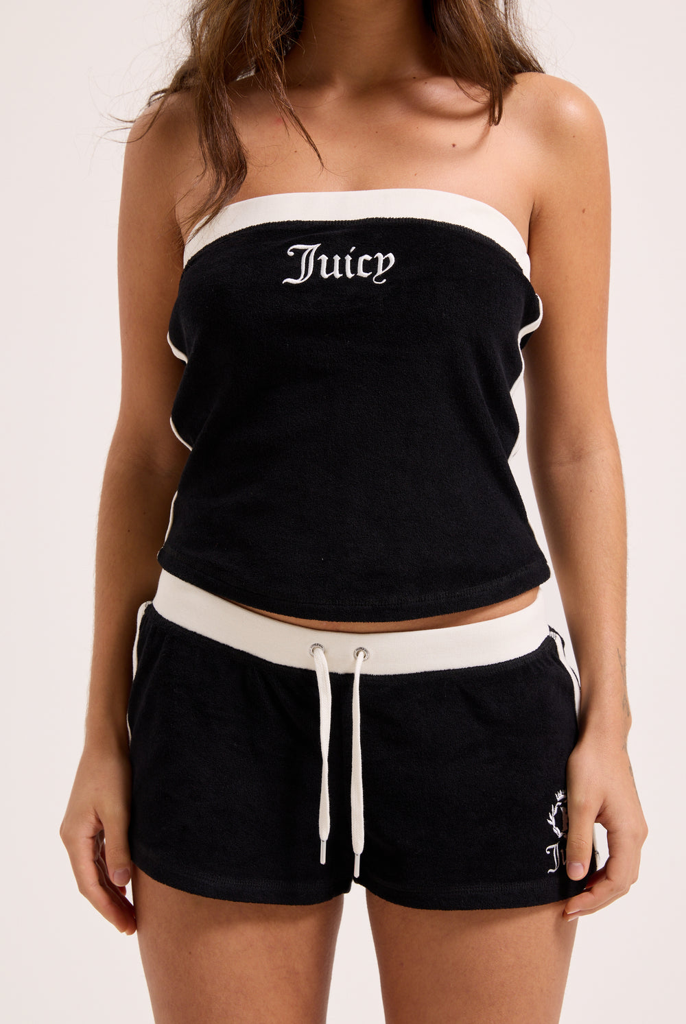 Displays a model wearing the Black contrast 'Juicy' branding Terry bandeau 