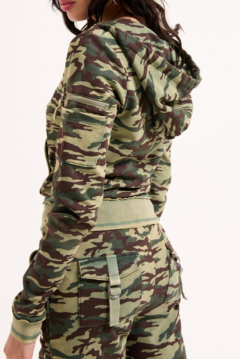 Displays a model wearing the Camo Print 'Juicy' branded washed cotton hoodie 