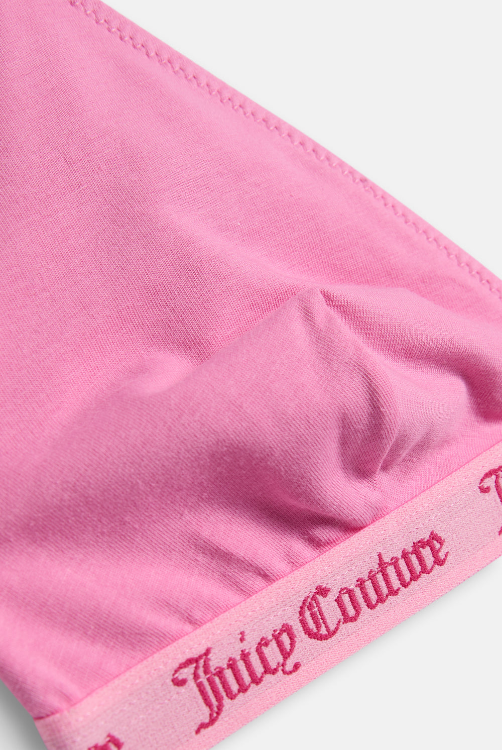 Displays the Pink 'Juicy' branded 3 Pack Scoop Cotton Triangle Bralettes featuring the juicy couture branding 