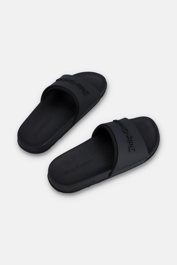 Displays a pair of the Black 'Juicy' branded embossed sliders 