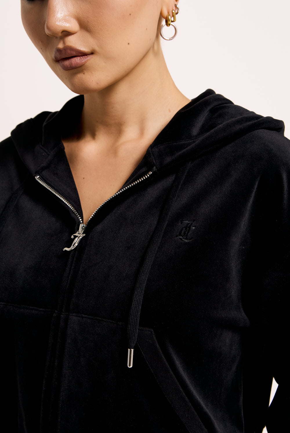 Displays the Black 'Juicy' branded crop oversized classic velour hoodie 