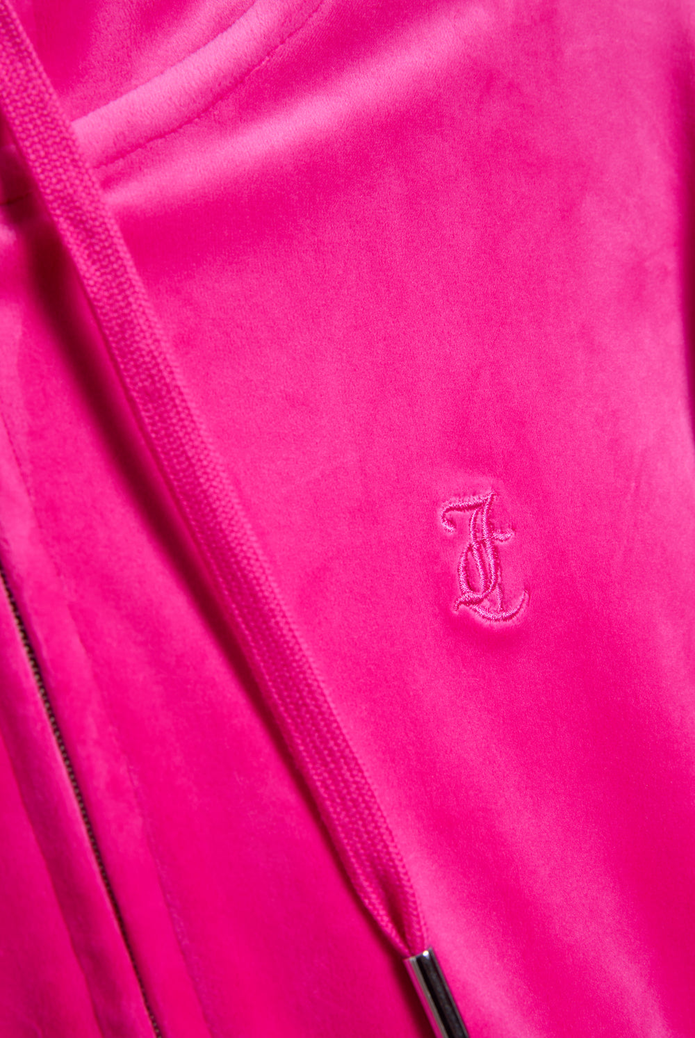 Displays he Nostalgia Pink 'Juicy' branded pink crop oversized classic velour hoodie featuring the juicy couture branding 