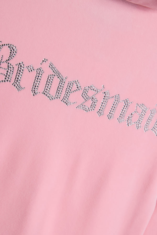 Displays the Juicy Pink 'Juicy' branded bridesmaid classic velour hoodie featuring the juicy branding 'bridesmaid' logo