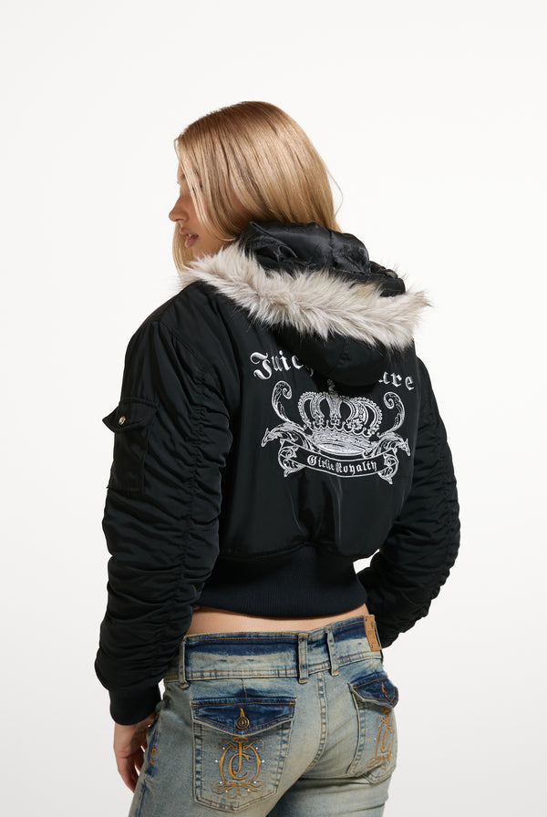 Displays a model wearing the Black 'Juicy' branded Nylon Bomber