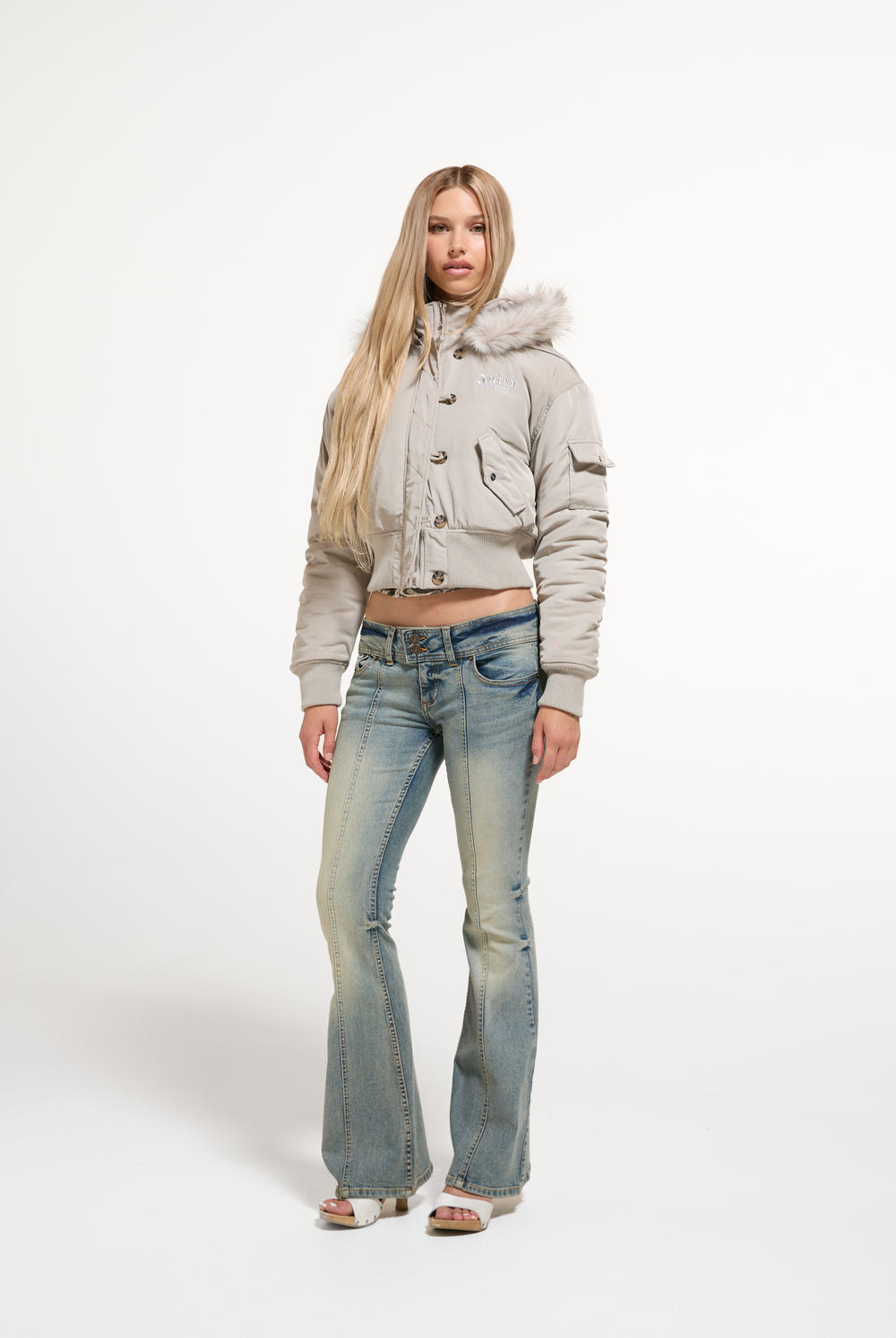 Displays a model wearing the String 'Juicy' branded Nylon Bomber