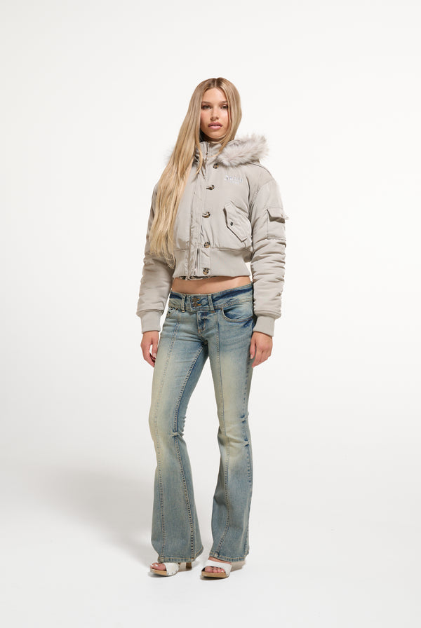 Displays a model wearing the String 'Juicy' branded Nylon Bomber
