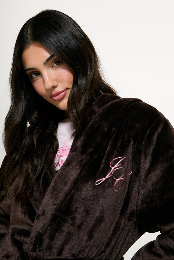 Displays a model wearing the Java 'Juicy' branded crown plush hooded robe 