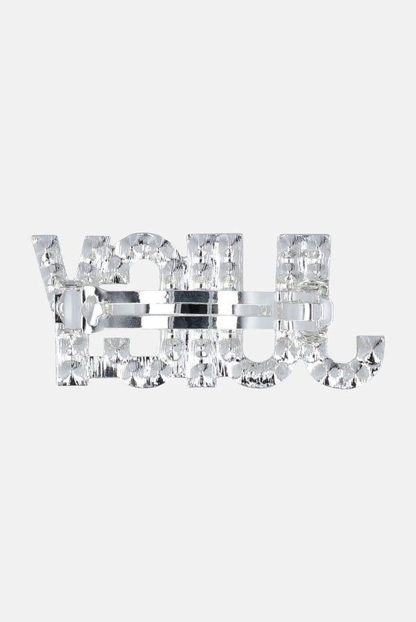 Displays the Crystal Silver 'Juicy' branded juicy hair clip 