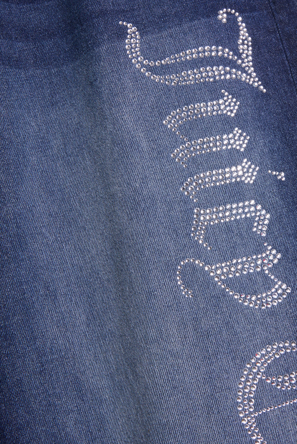 Displays the mid Wash 'Juicy' branded wide leg Diamanté jeans featuring the juicy couture branding 