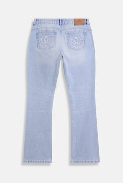 Displays he Light Wash 'Juicy' branded Dog crest bootcut jeans