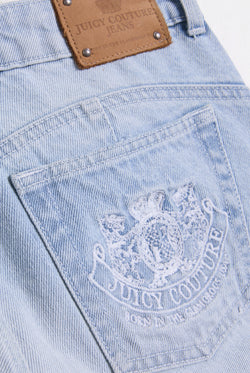 Displays he Light Wash 'Juicy' branded Dog crest bootcut jeans featuring the juicy logo