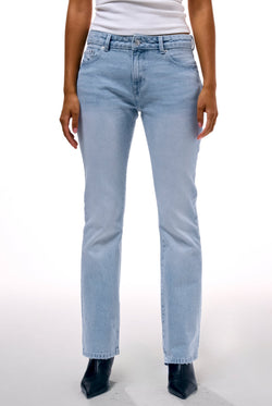 Displays a model wearing the Light Wash 'Juicy' branded Dog crest bootcut jeans