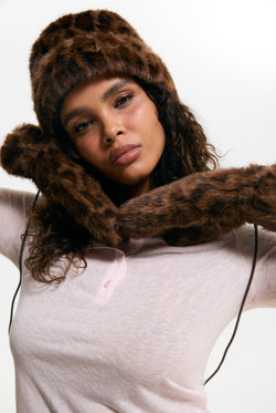 Displays a model wearing the Leopard Print 'Juicy' branded Drawstring Fur Mittens