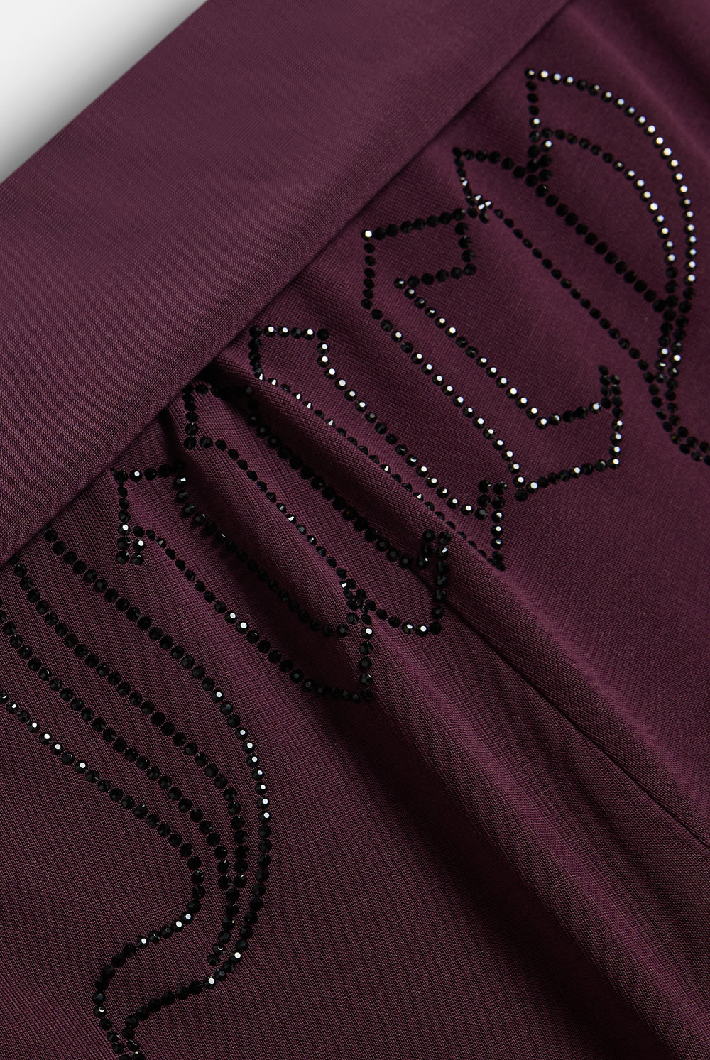 Displays the Winetasting 'Juicy' branded Belted Flare Trousers featuring the juicy branding 