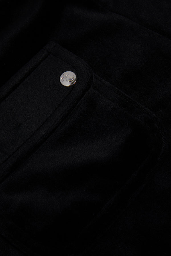 Displays the Black 'Juicy' branded classic velour track short with back pocket featuring the juicy logo