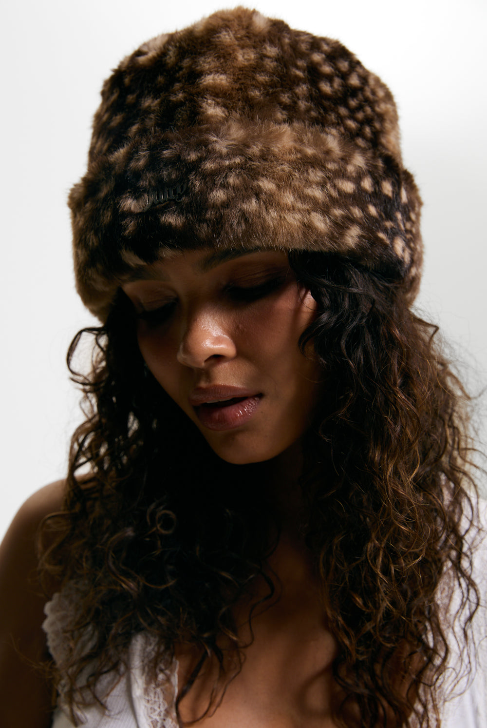 Displays a model wearing the Bambi Print 'Juicy' branded Faux Fur Hat