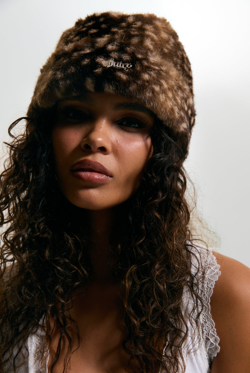 Displays a model wearing the Bambi Print 'Juicy' branded Faux Fur Hat