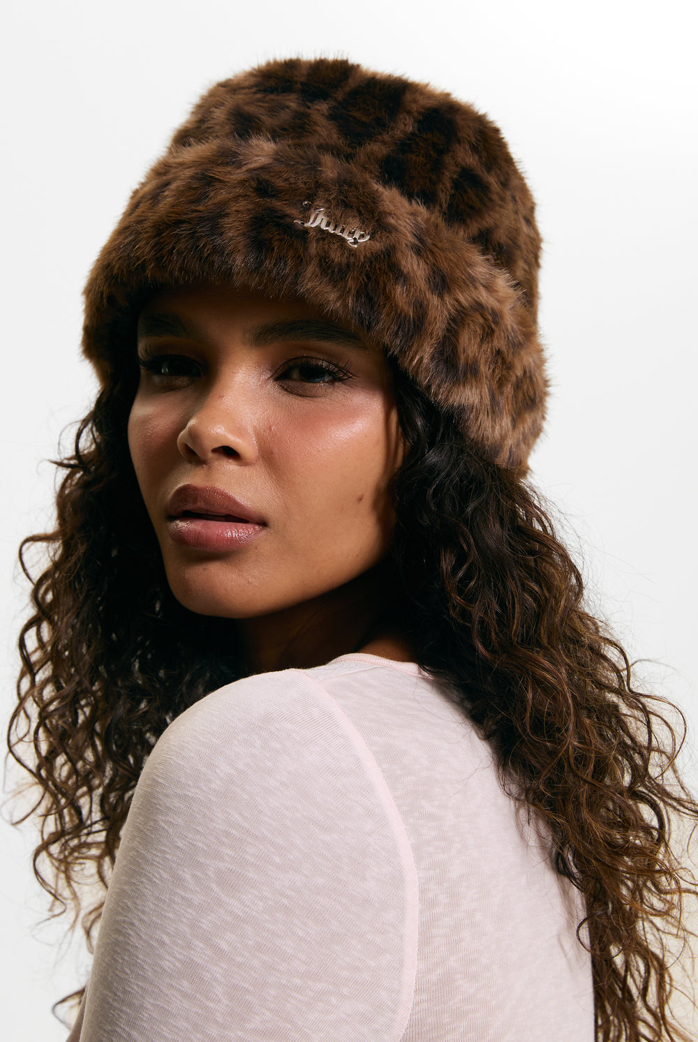 Displays a model wearing the Leopard Print 'Juicy' branded Faux Fur Hat