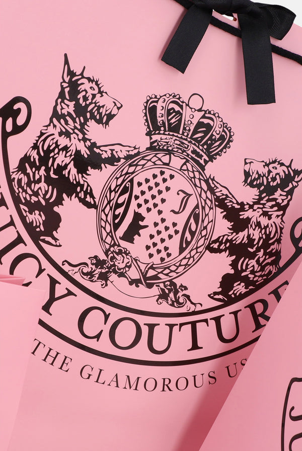 Displays the Pink 'Juicy Couture' branded pink crest gift carrier bag featuring the juicy branding 