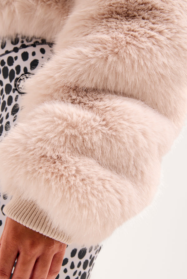 Display the cream hooded 'Juicy' branded faux fur jacket 