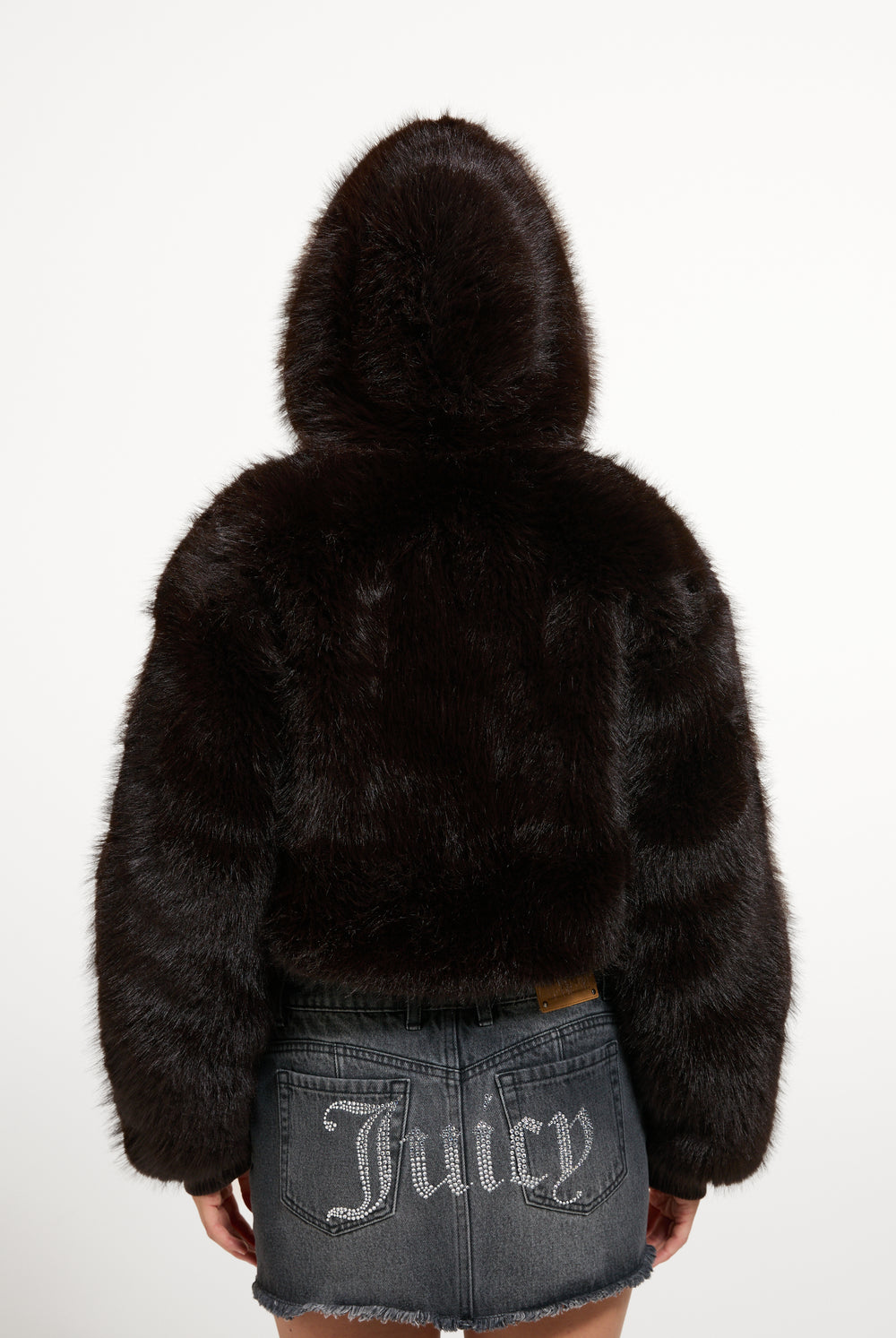 Displays a model wearing the Java 'Juicy' branded Hooded Faux Fur Jacket