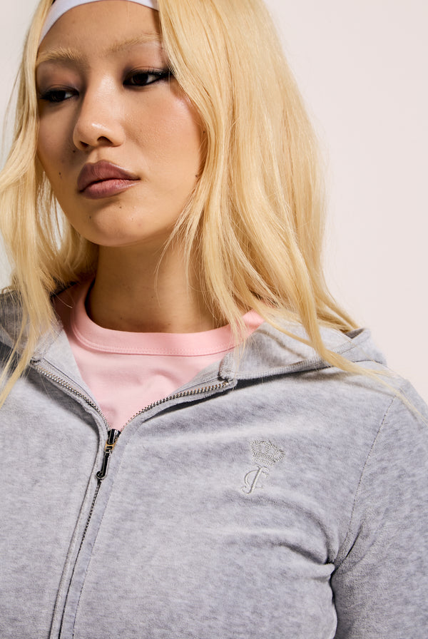 Displays a model wearing the Silver Marl 'Juicy' branded bamboo velour heritage hoodie 