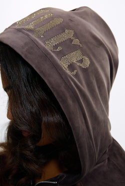 Displays a model wearing the Java 'Juicy' branded Old Gothic Oversized Cropped Hoodie