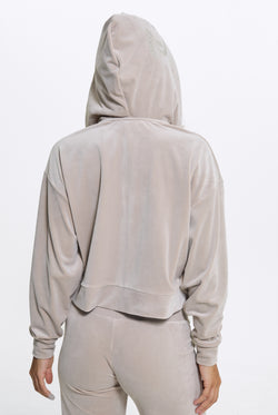 Displays a model wearing the String 'Juicy' branded Old Gothic Oversized Cropped Hoodie