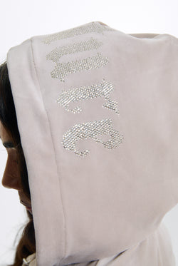Displays a model wearing the String 'Juicy' branded Old Gothic Oversized Cropped Hoodie