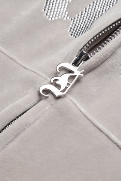 Displays the String 'Juicy' branded Old Gothic Oversized Cropped Hoodie featuring the juicy branding on the zip