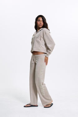 Displays a model wearing the String 'Juicy' branded Old Gothic Diamante Og Straight Leg Trackpant