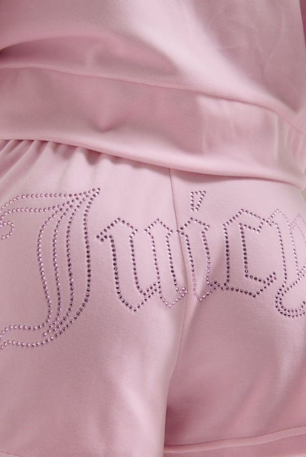 Displays the Cherry Blossom 'Juicy' branded velour outline diamanté track shorts 