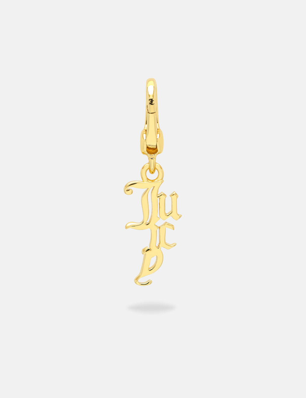Displays the Gold 'Juicy' branded drop charm 