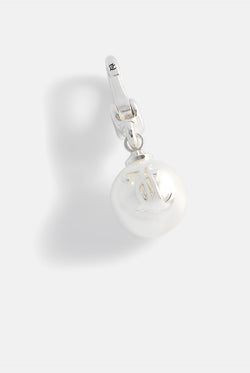Displays the silver 'Juicy' branded JC pearl charm 