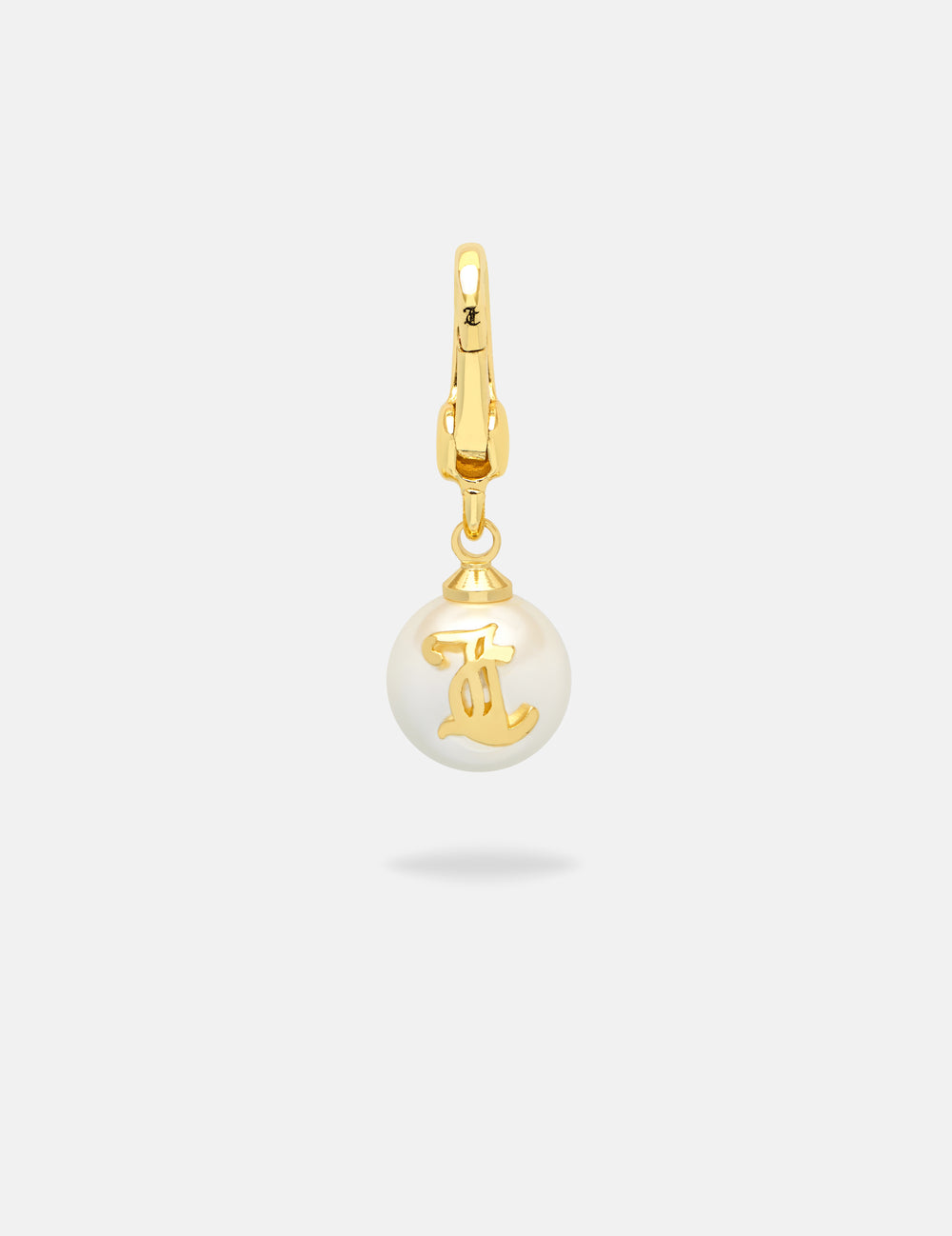 Displays the Gold 'Juicy' branded JC Pearl Charm