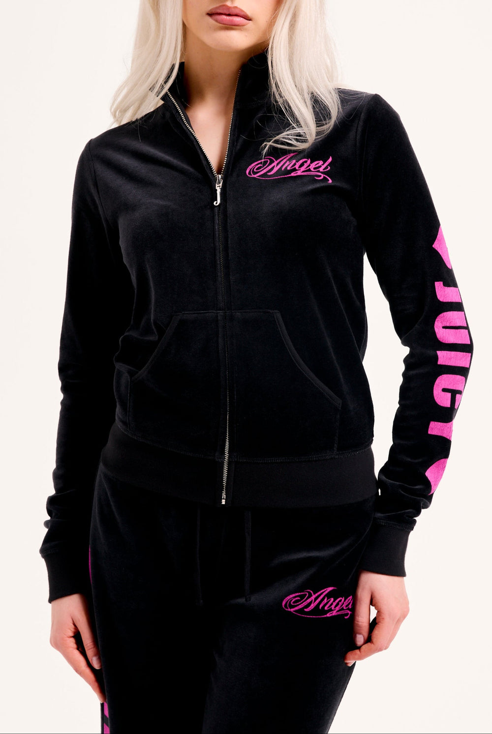 Displays a model wearing the Black 'Juicy' branded angel cotton velour track top