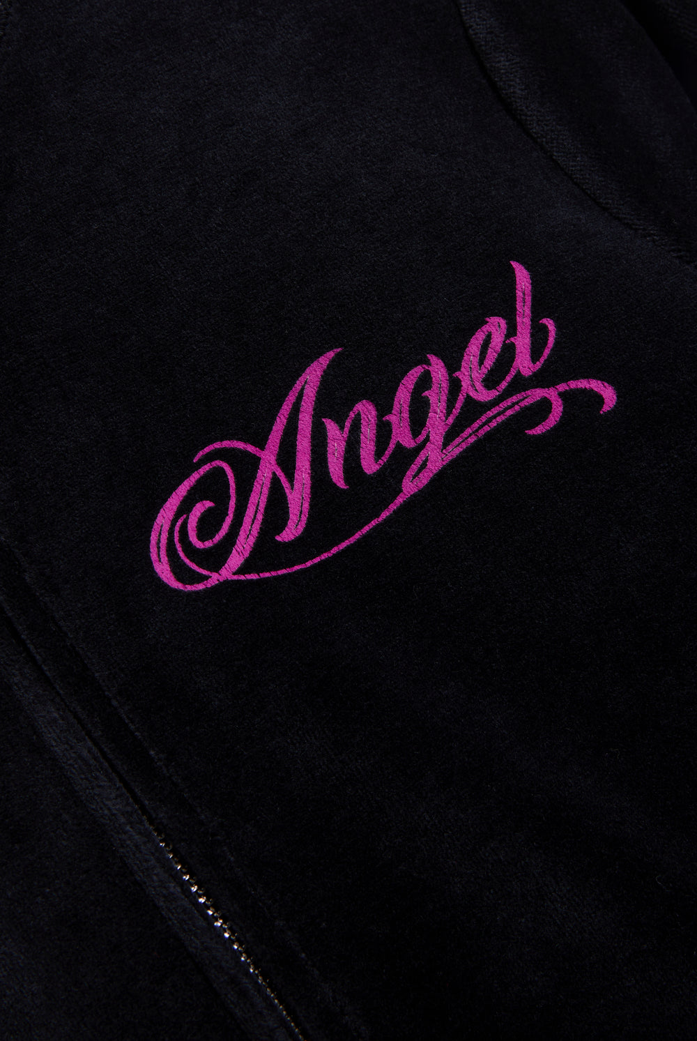 Displays the Black 'Juicy' branded angel cotton velour track top featuring the angel logo