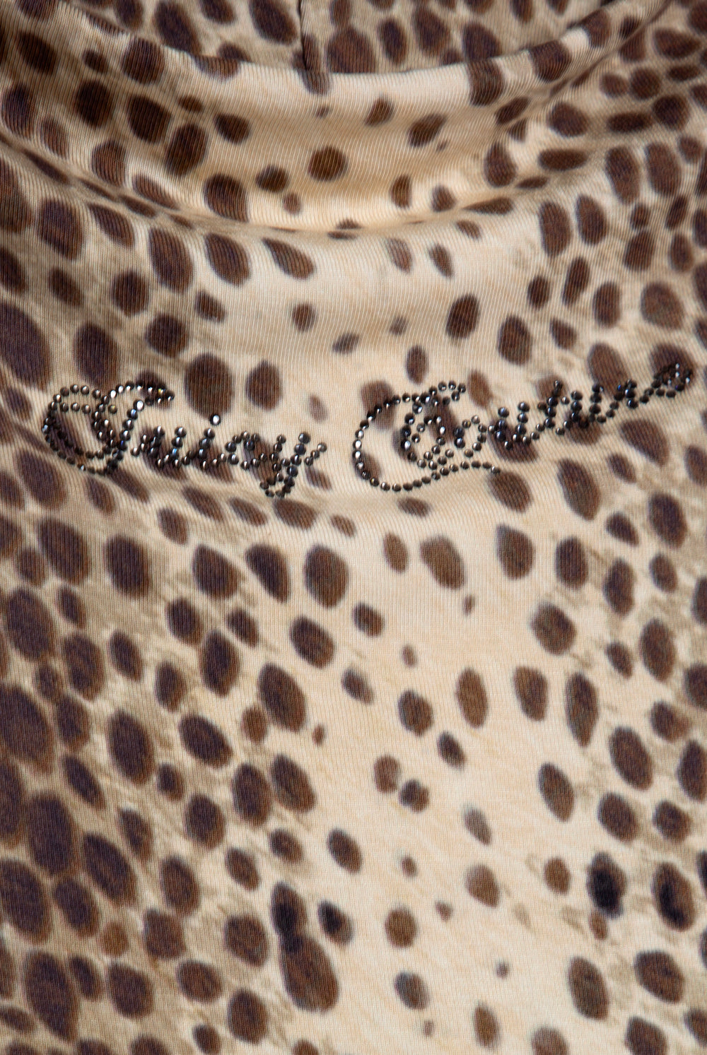 Displays the natural cheetah print 'juicy' branded off the shoulder jc top featuring the juicy couture branding 