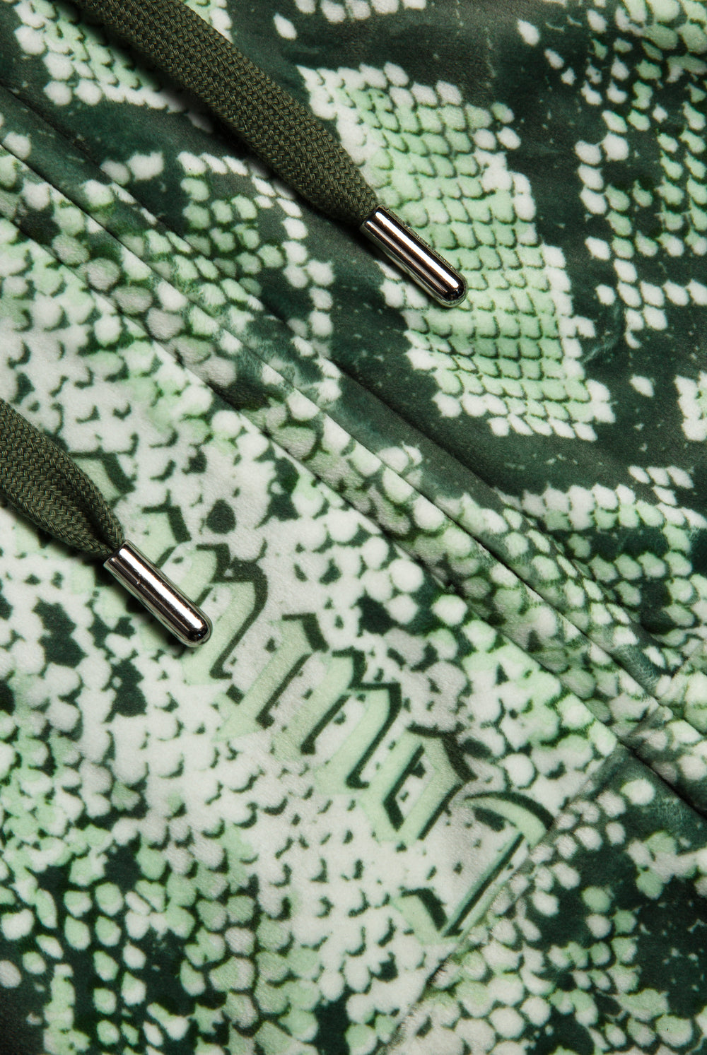 Displays the Green snake print 'Juicy' branded diamanté oversized cropped hoodie 